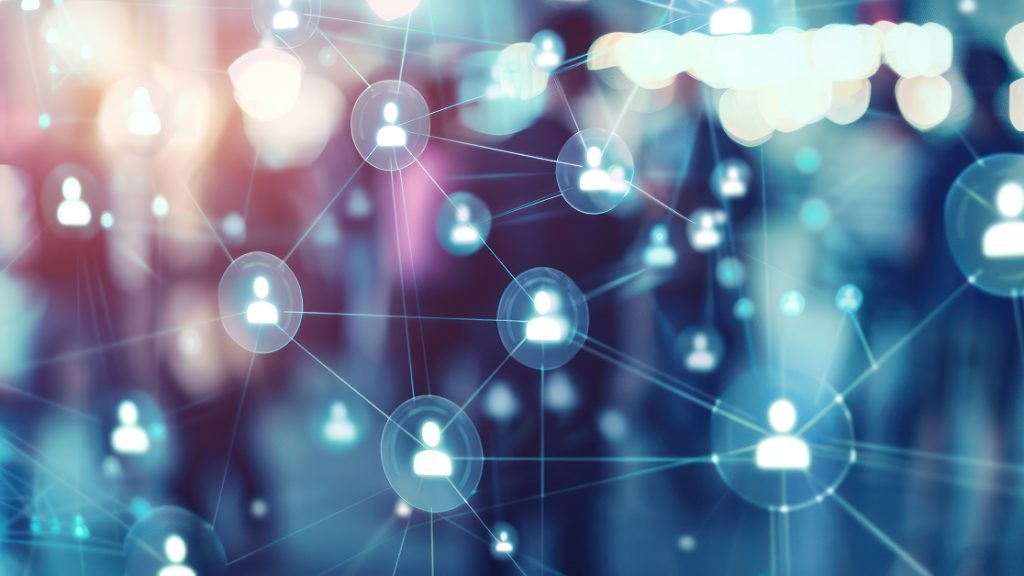Abstract image showing a network of connected user icons over a blurred crowd, representing digital communication and online connectivity among thought leaders, industry experts, and a global network of universities included in the Nemetschek Global Academic Program.